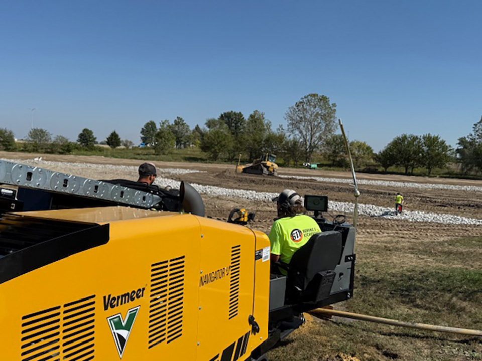6 1 1 Boring and Excavating employees looking at an area where directional boring equipment will be used
