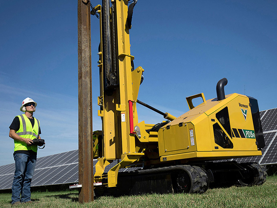 6 1 1 Boring and Excavating employee operating solar pile driving equipment
